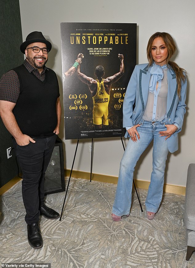 “What a journey this has been,” she added, “and I honestly feel like the best is yet to come”; Lopez and Davis pictured at the event