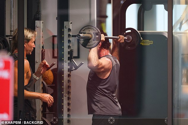 The Wolverine star completed his look with black shorts as he lifted heavy weights under the guidance of the famous trainer and his good friend Michael Ryan.