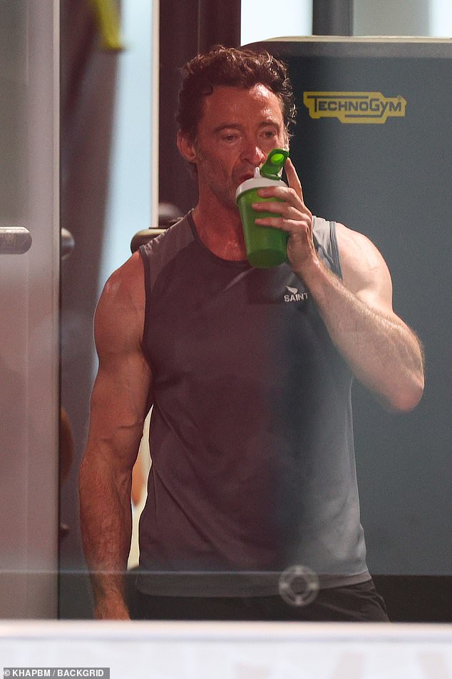 After the intense training session, Hugh was seen taking a well-deserved break and guzzling water from his bottle