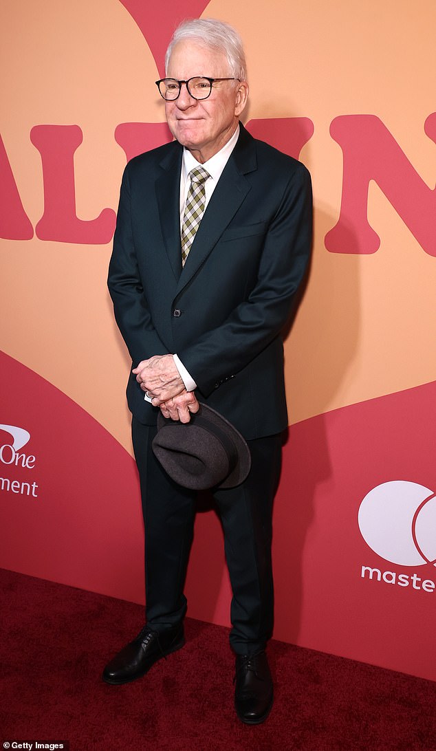 Steve Martin, 79, looked great in a dark suite, black dress shoes and a dark gray fedora hat