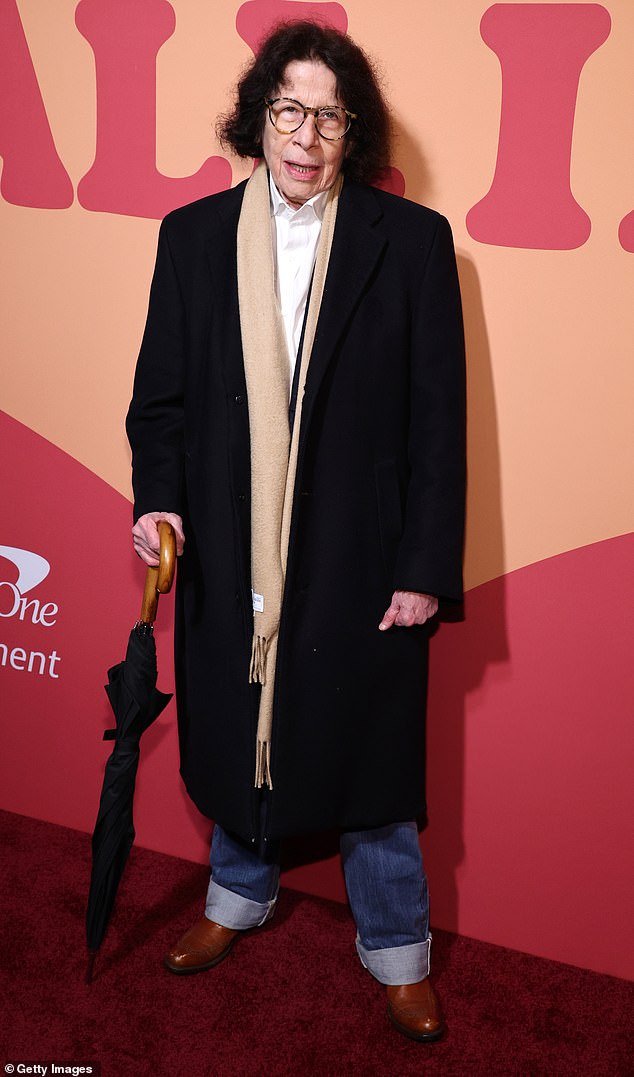 Writer Fran Lebowitz, 74, stepped out in cuffed jeans, brown boots and a long, dark coat