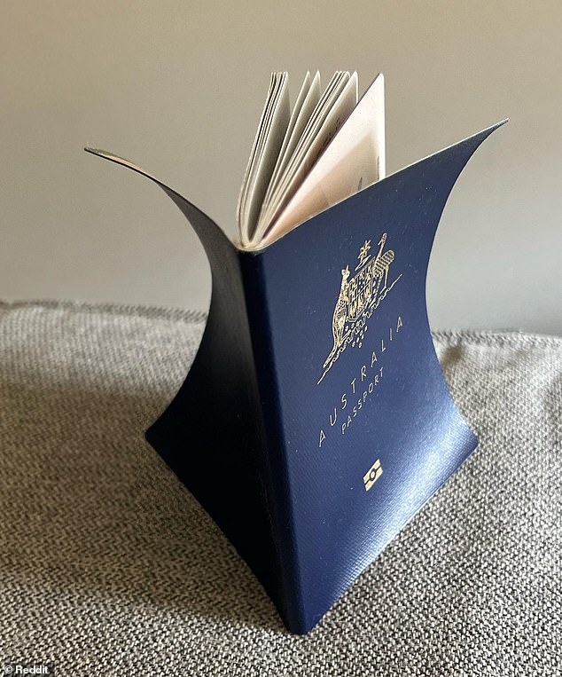 The new R-series Australian passport is thinner than the previous one and curves outward (brand new passport shown)