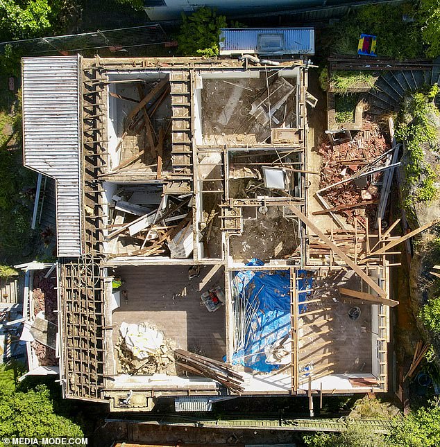 Aerial photographs taken on Monday also show that part of the building's wall has been demolished