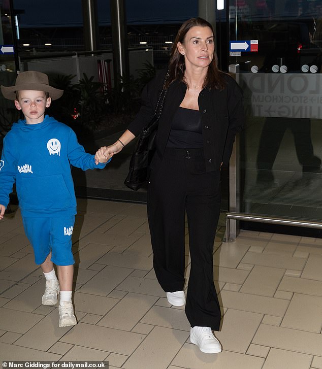 The football manager, 39, was not at Manchester airport to meet his wife when she landed on December 11 with their two youngest sons Kit, eight, and Cass, six.