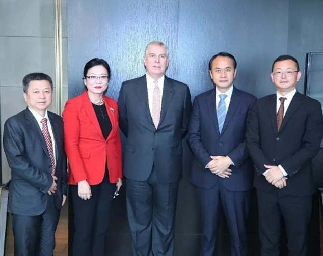 Tengbo (far right) poses with Andrew at an event to boost trade between China and Britain