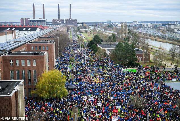 Several thousand employees of Europe's largest carmaker Volkswagen AG gather during protests against pay increases at the site of VW's largest factory in Wolfsburg, Germany, December 2