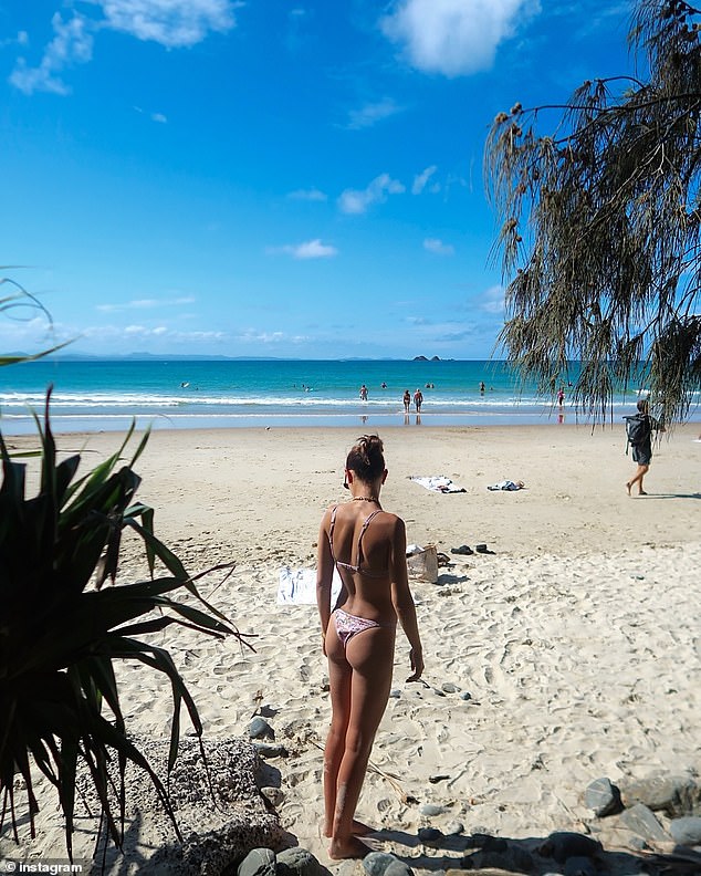 One photo showed the beauty turning her back to the camera while wearing a tiny triangle bikini. The pale swimwear left little to the imagination