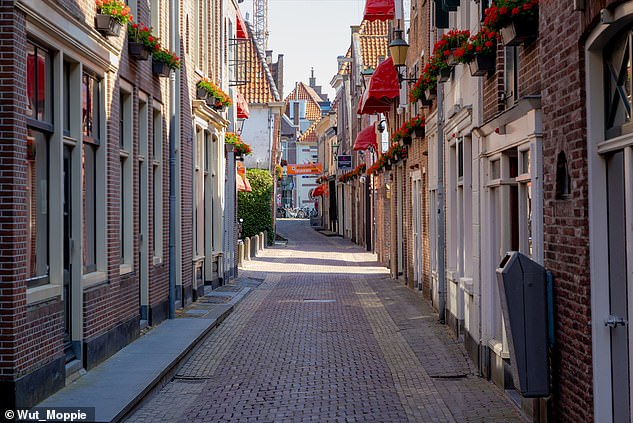 The Achterdam (photo) - a 150 meter long street with window prostitution on either side - is located in the middle of the old center of Alkmaar