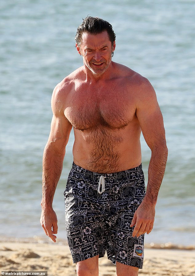 The Australian actor, 56, proved he stays in superhero shape as he showed off his toned physique during his day out at the beach