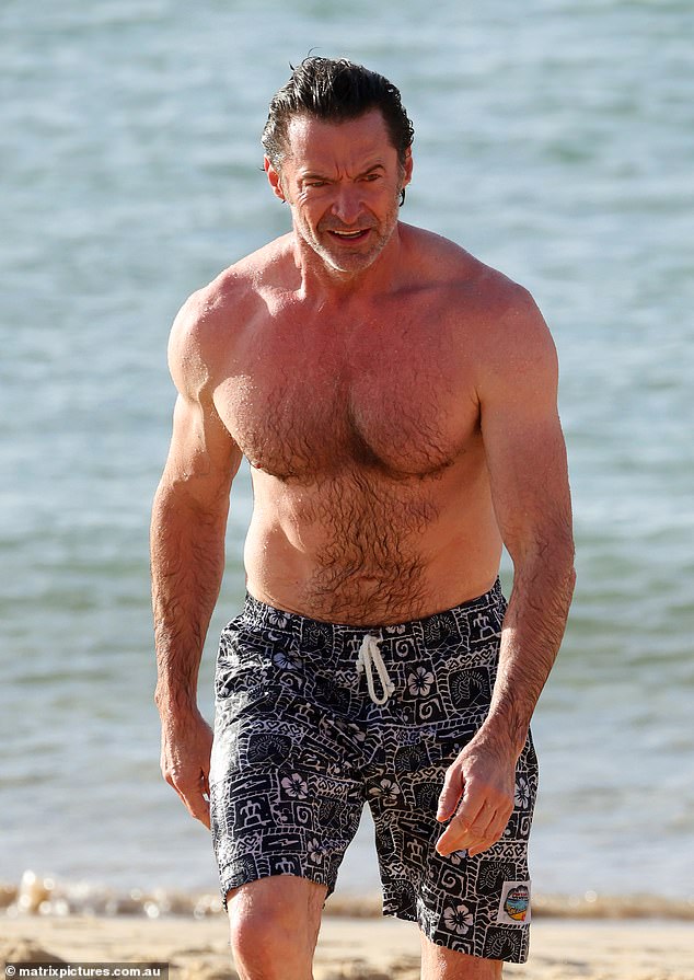 Hugh cooled off amid the humid climate with a dip in the sea and then walked on the beach in the sultry heat