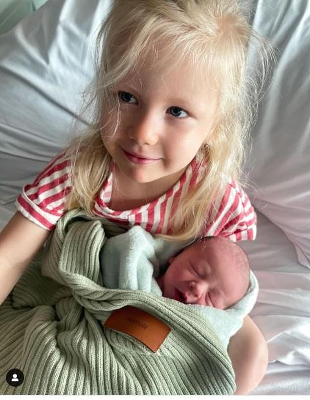 Jules posted a heartwarming photo of their three-year-old daughter Piper Rose cradling her new baby brother at the Mater Mothers Hospital