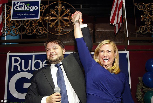 Ruben Gallego, left, celebrates his victory in the 7th Congressional District Democratic primary with his wife Kate Gallego, August 26, 2014, in Phoenix