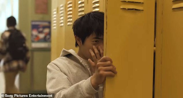 In a series of quick clips, Han's student Li is shown being displaced from Beijing and forced to move to New York City with his mother. He has trouble fitting in at school and at one point is seen checking out his black eye after encountering a group of bullies at school.