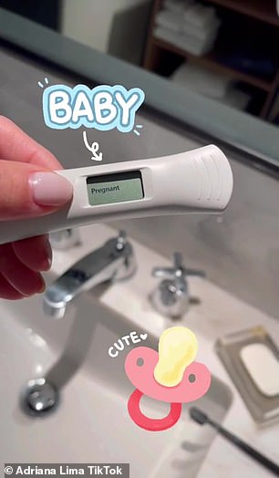 A closer look: She holds the test over a sink while adding a pacifier with the word 