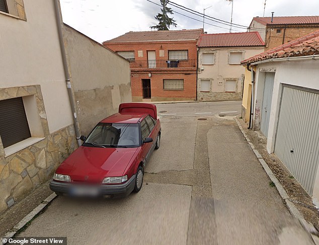 The Google Street View photos show the red Rover car parked on the side of the road, with the trunk open