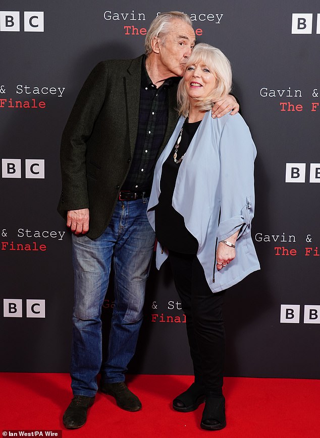 Larry placed a sweet kiss on Alison's head as they posed for a photo