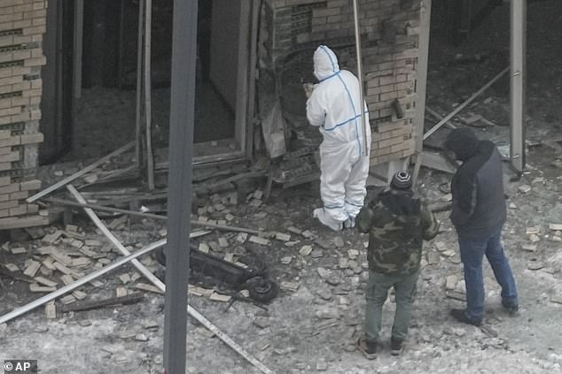 Investigators work near a scooter at the site where Lieutenant General Igor Kirillov, the head of Russia's nuclear, biological and chemical forces, and his aide Ilya Polikarpov were killed by an explosive device