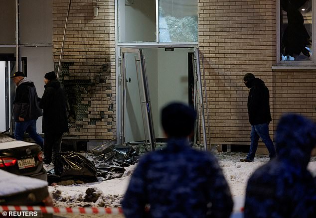 Two body bags are seen after the bomb was detonated outside the Moscow apartment