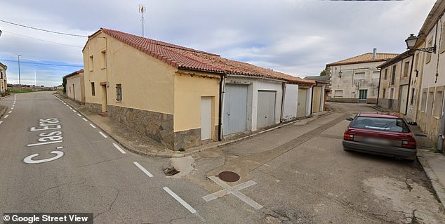 The person, who can only be seen from a distance and is not visible in close-ups of the road, is just around the corner from where the red car was parked