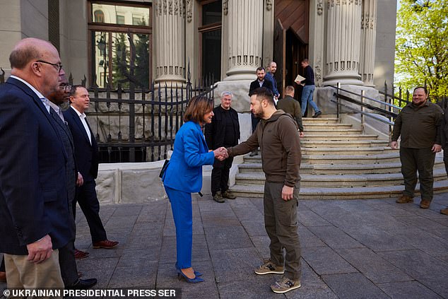 Pelosi shakes hands with Ukrainian President Volodymyr Zelensky in war-torn Ukraine in 2022