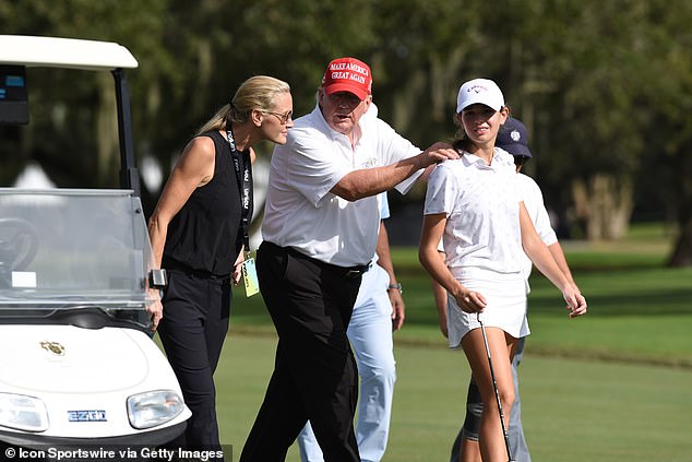 Donald Trump, mid-walks with his niece Kai Trump and her mother Vanessa, in 2022