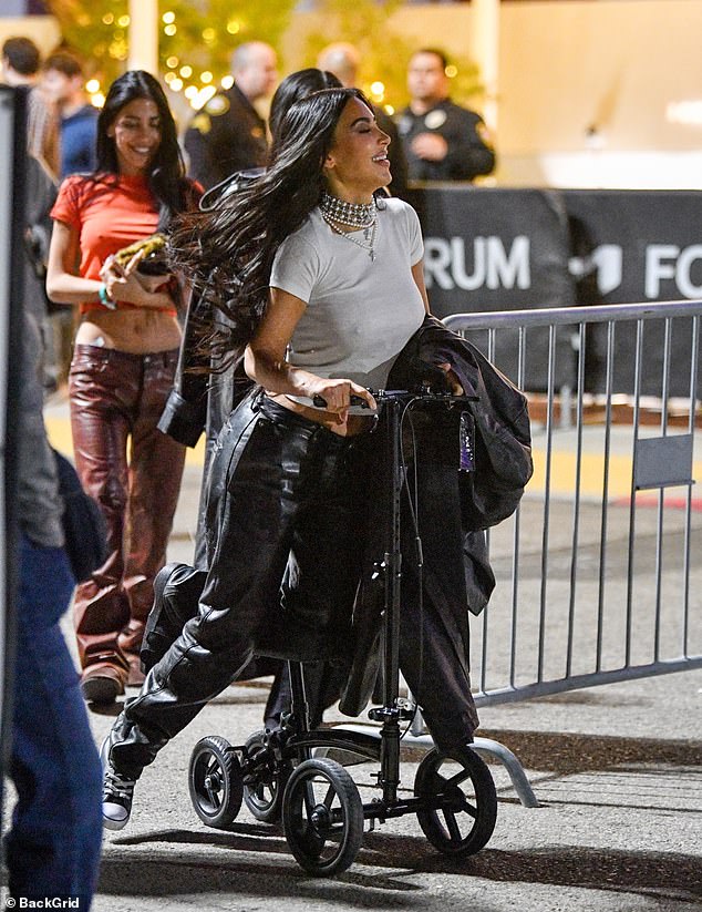 Kim giggled as she zipped around on the scooter, followed by her friends as they headed back to her chauffeured car