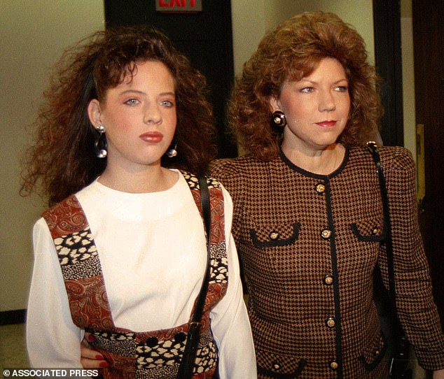 High school cheerleader Amber Heath, left, and her mother Verna Heath enter a courtroom in Houston, September 3, 1991