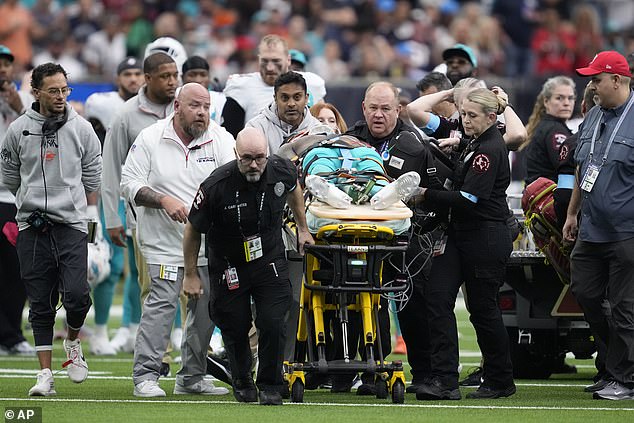 Miami Dolphins wide receiver Grant DuBose (88) is carted off the field after an injury