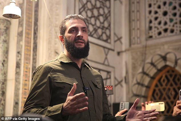 Ahmed al-Sharaa addresses a crowd at the capital's striking Umayyad Mosque on December 8