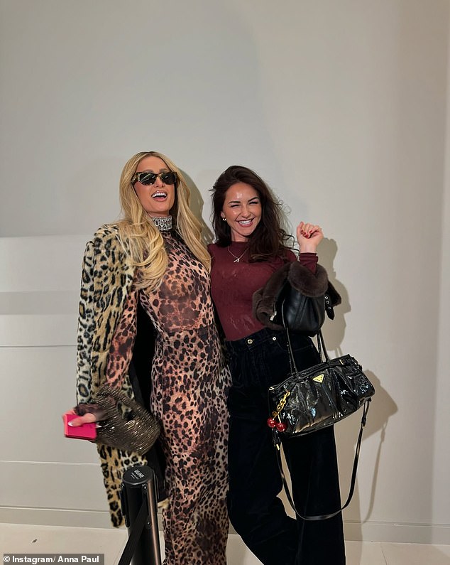 She shared a photo with Paris Hilton, who wore a sexy leopard print ensemble, complete with tight top, fitted skirt and jacket. Both shown