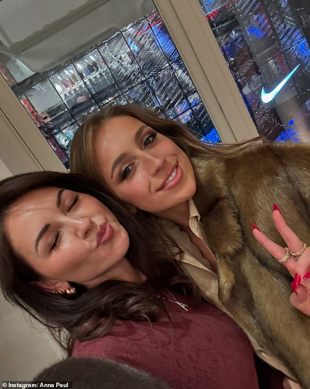 She also shared a cheeky selfie with Canadian pop star Tate McRae, who wore a collared shirt and brown fur coat as she gave a peace sign next to Anna. Both shown