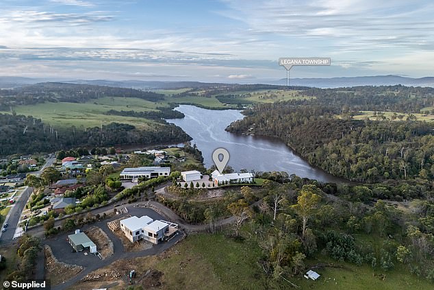 The house sits on top of a hill overlooking Lake Trevallyn