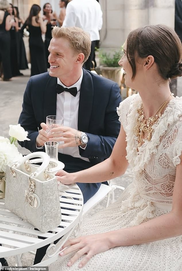 The couple exuded old Hollywood elegance, with Simpson looking every dashing date in a classic black tuxedo