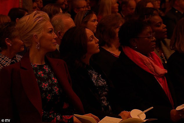 As he performs the Christmas carol - written by Noël Regney and Gloria Shayne in 1962 as a plea to end the Cuban Missile Crisis - the camera pans to show an audience engrossed in his rendition