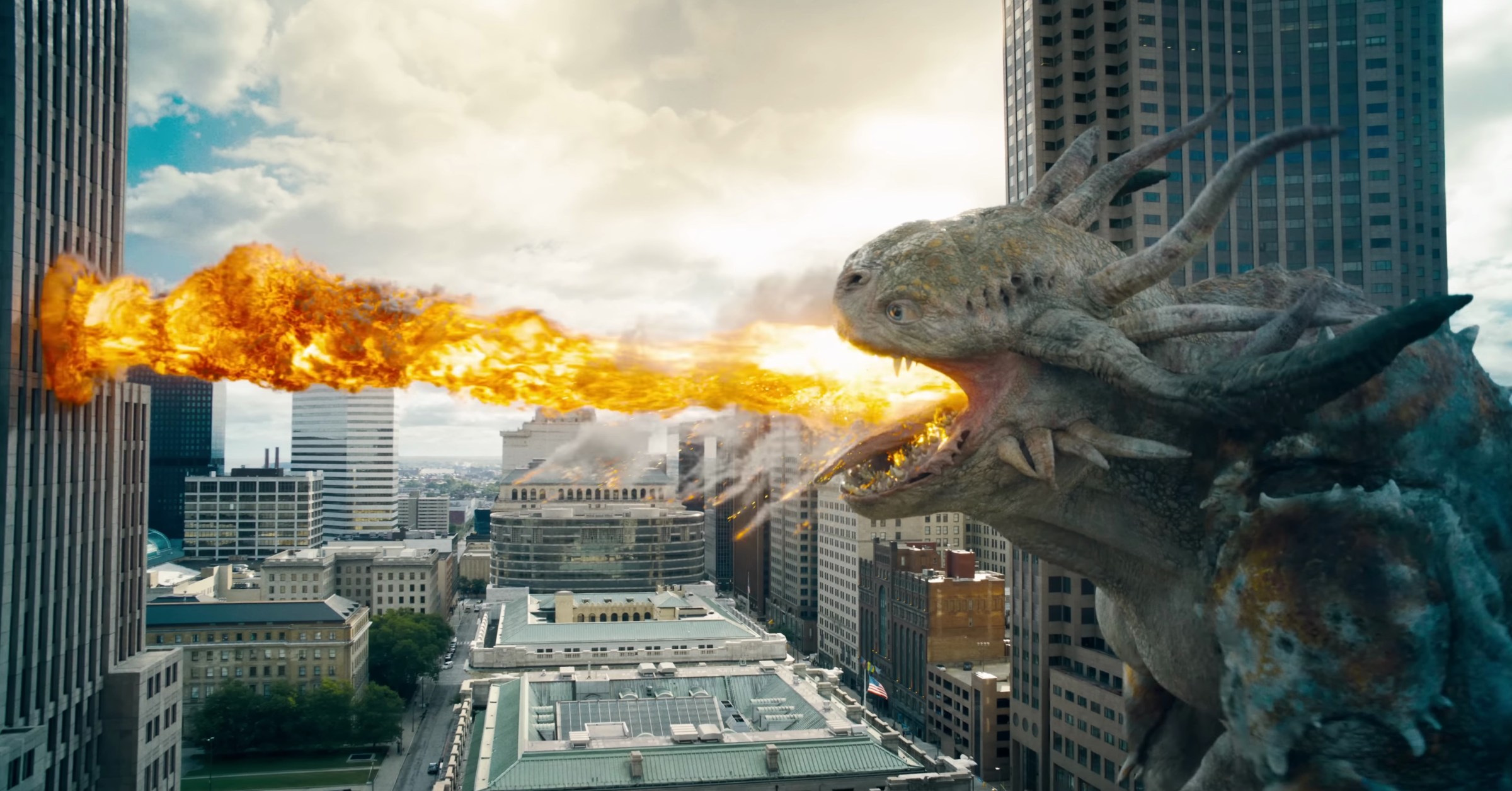 A Kaiju breathes fire into a building in Superman 2025