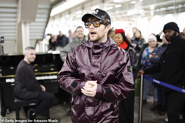 To complete his look, he opted for yellow-tinted sunglasses and a black baseball cap