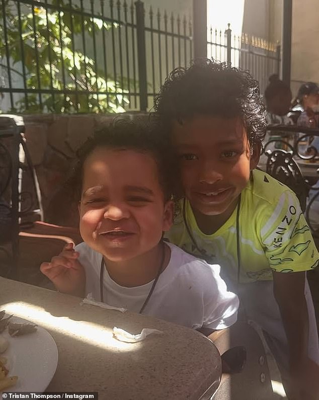 Tatum and Theo smile as they enjoy lunch