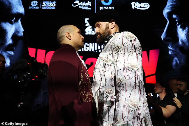 The pair had to be pulled around after standing face-to-face for over ten minutes at the final press conference ahead of their heavyweight rematch