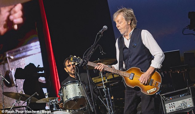 Paul took the stage playing guitar while bringing up Ringo to play drums with him