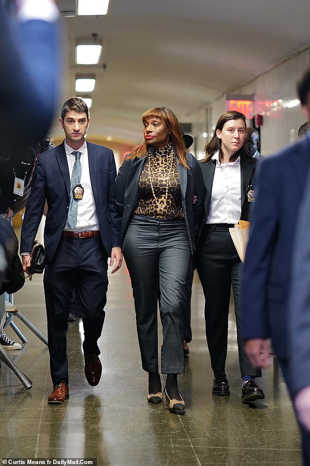 Ingrid Lewis-Martin, who until recently was one of the most powerful people in the city government, was brought into a Manhattan courtroom in handcuffs on Thursday