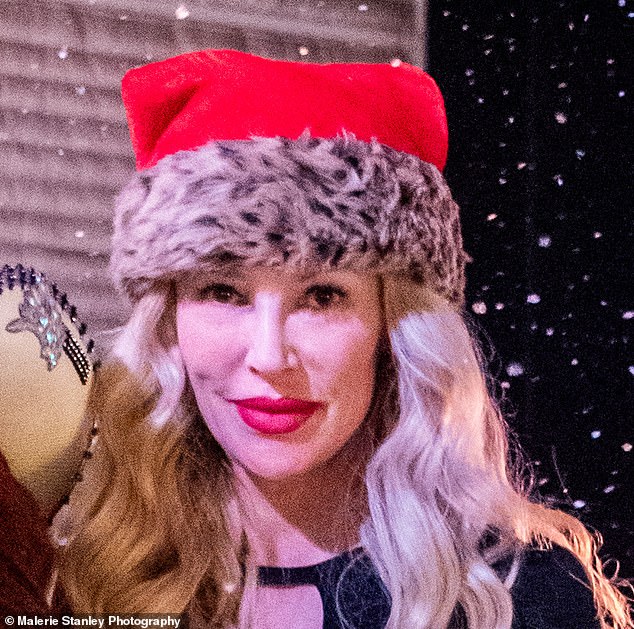 Brandi pictured at the event wearing the festive hat, perfect for the holidays