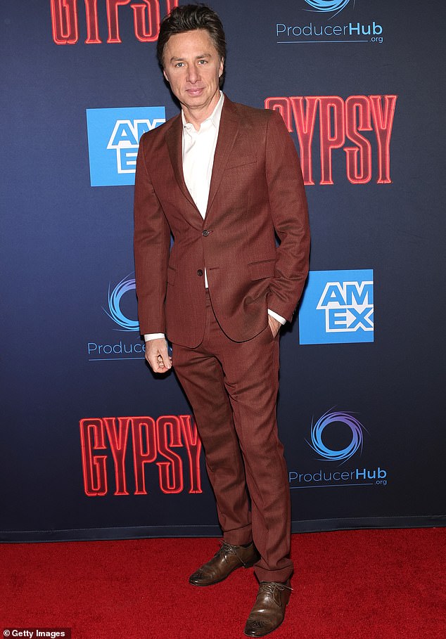 Exuding youthful charm at the age of 49, Scrubs star Zach Braff hit the red carpet in a rust-colored suit worn dashingly without a tie