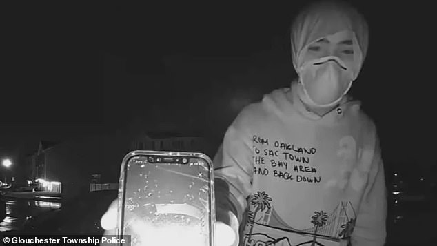 Just two days after the brazen theft, a lone porch pirate returned to the scene under cover of night – and wearing a face mask and hoodie – to complain about scandalous images the victim posted online.