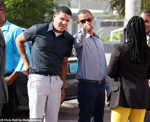 Bethel and alleged hitman Faron Newbold (right) were photographed outside the Bahamas Magistrate's Court in Nassau last November