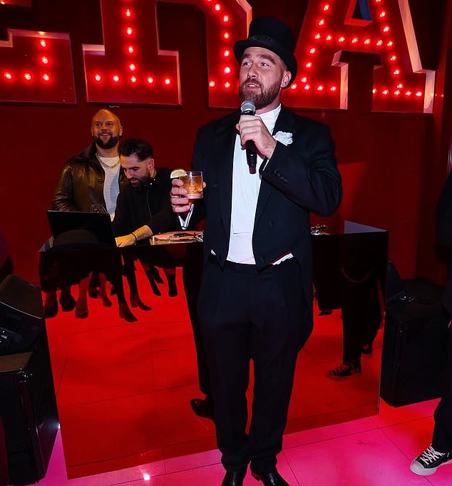 The footballer, who was dressed in the same tuxedo and top hat he wore when he joined her on stage at Wembley Stadium in London last summer, sweetly presented her with a black fedora.