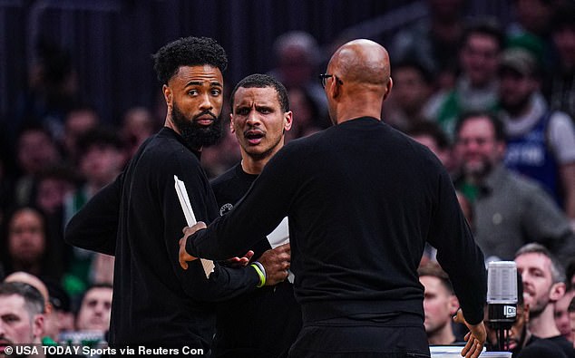 Joe Mazzulla is restrained by assistant coach Sam Cassell (right) while responding to a technical foul