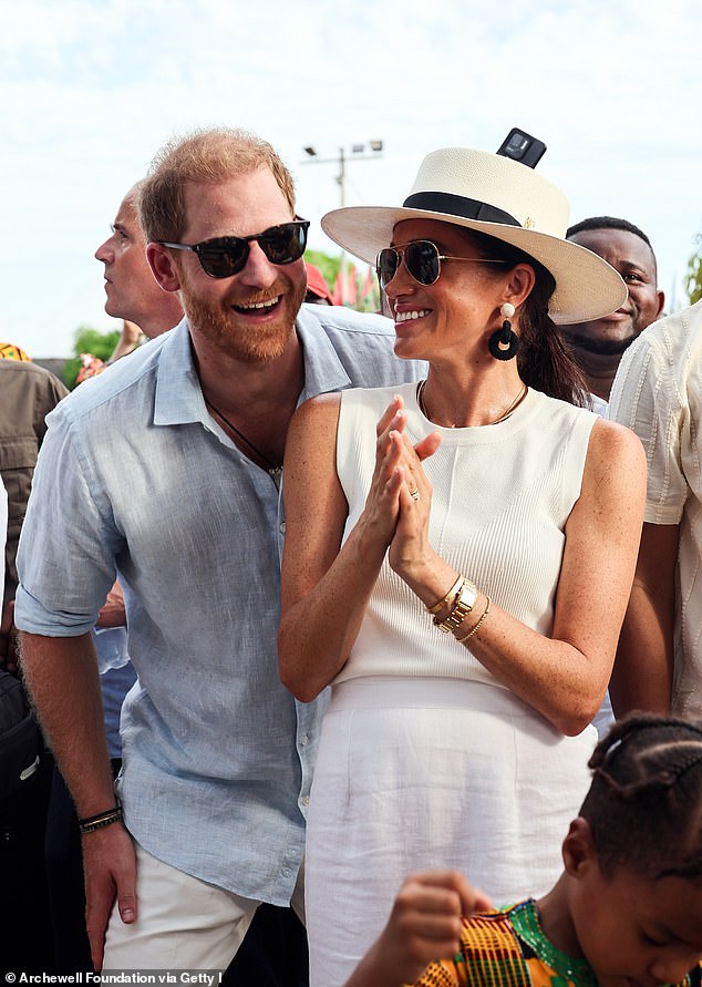 Prince Harry and Meghan are pictured in San Basilio de Palenque in Colombia