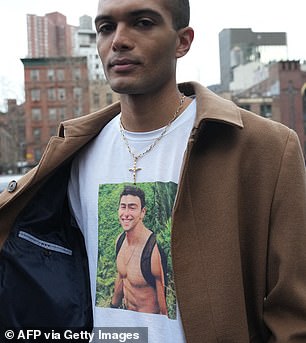 A supporter wears a Luigi Mangione t-shirt