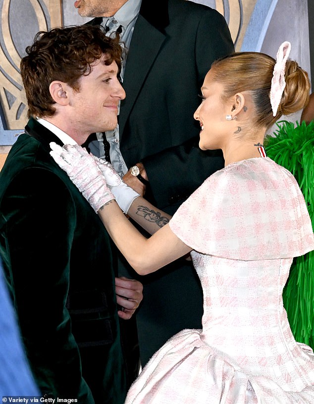 Ariana and Ethan at the Wicked Los Angeles premiere, where the singer fussed over her boyfriend on the red carpet