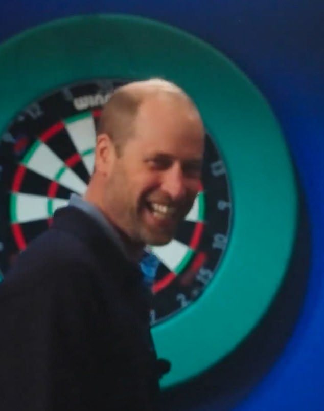 Dressed in plastic-free trainers from British brand HEVEA and a casual blue jumper, William looked relaxed as he played darts with Hannah